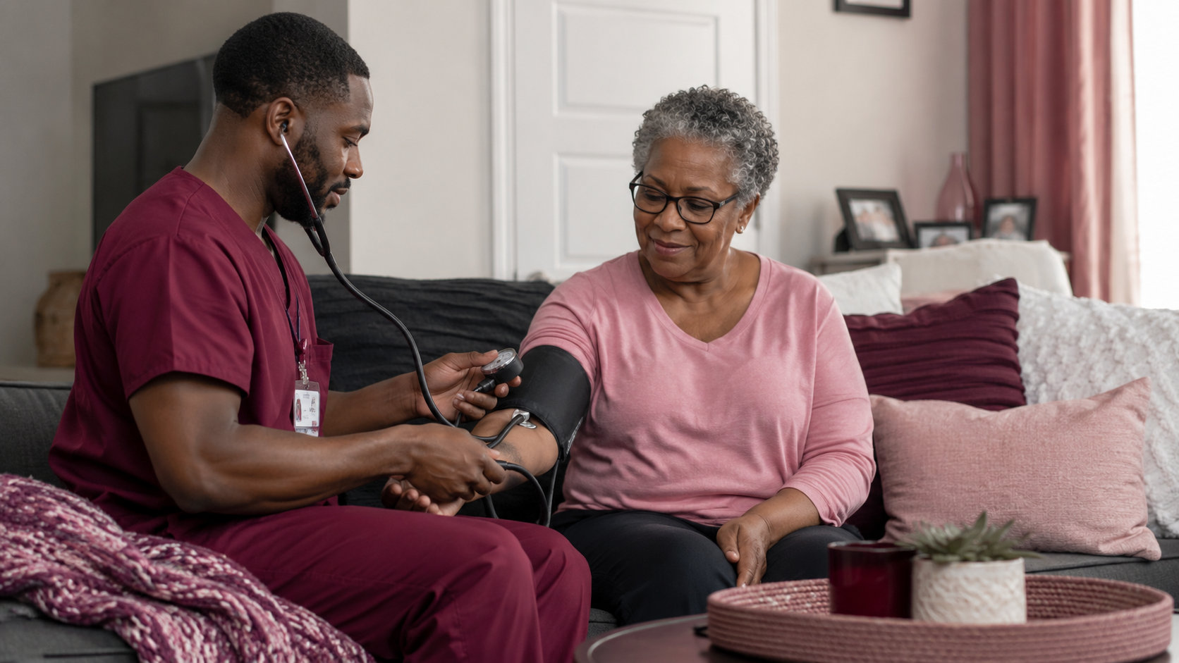 Caregiver checking a client's blood pressure at home